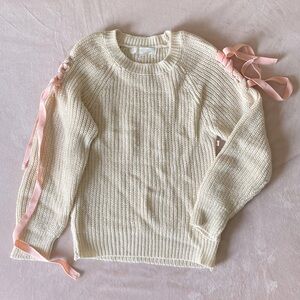 Sweater with pink ribbon